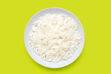 Dish of rice on green background.