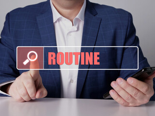  ROUTINE text in search bar. Businessman looking for something at cellphone. ROUTINE concept.