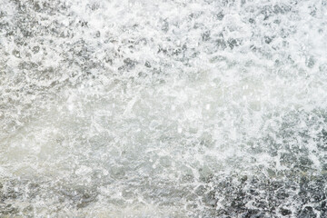 Splashes of clear water. Refreshing fountain in the park in the summer heat.