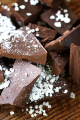 Pieces of dark chocolate with sea salt. Salted dark chocolate.