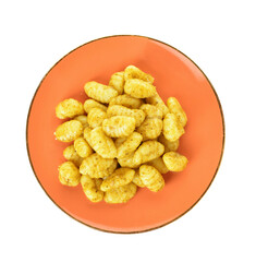 Plate with tasty pesto gnocchi on white background