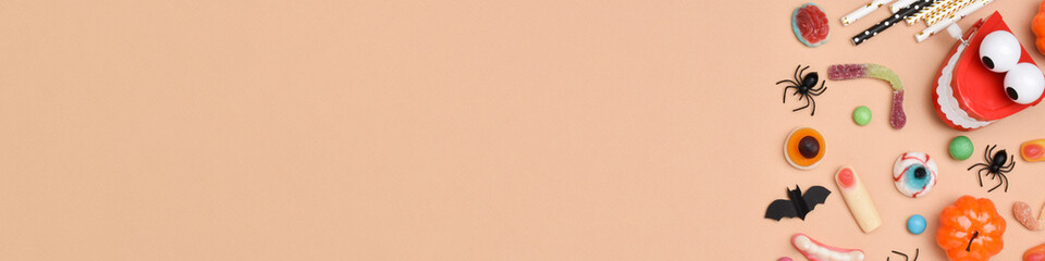 A banner with various sweets on an orange background with space for text.