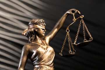 Bronze Lady Justice With Scales And Black Background