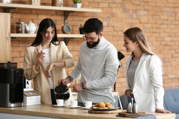 People having coffee break in office