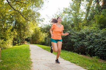 Female Runner Jogging during Outdoor Workout in a Park