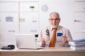 Old male employee in remuneration concept