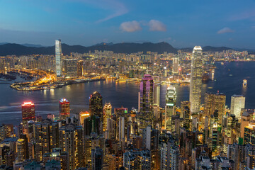Scenery of Victoria harbor of Hong Kong city at dusk, viewed from the peak