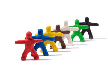 Multicolored people made of plasticine stand behind each other on a white background