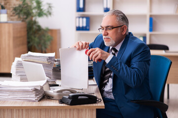 Old male employee and too much work in the office