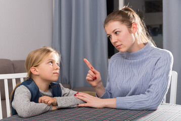 Mother warns little daughter. High quality photo