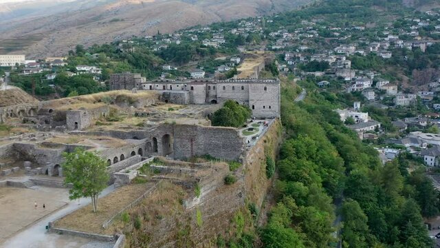 Castle of Gjirokastra and city center. Aerial view of ancient fortress Albania