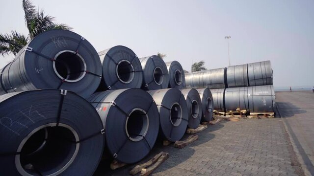 Black metal coils, outside at the Goa Port in sunny India - circling view