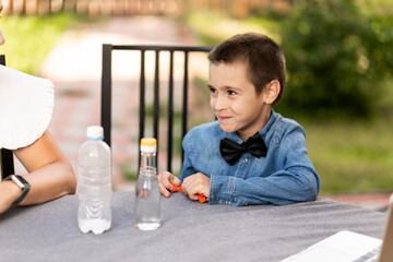 Mom and son are conducting chemical experiments at home. An experience with a child about creating...