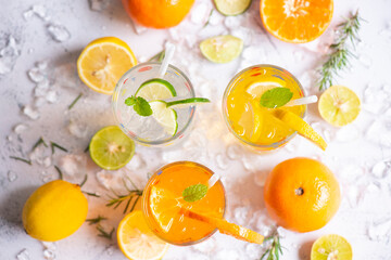 Colorful summer drink juicy, Exotic summer drinks refreshing variety of cold drinks glasses fresh fruit on ice homemade cocktail tea with mojito lemon lime orange rosemary and mint leaf