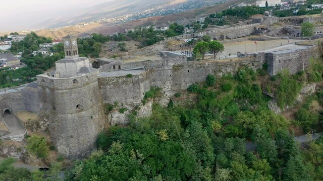 Castle of Gjirokastra and city center. Aerial view of ancient fortress Albania