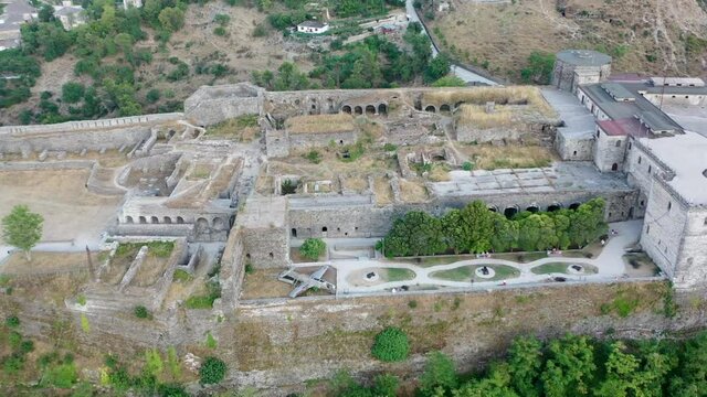 Castle of Gjirokastra and city center. Aerial view of ancient fortress Albania
