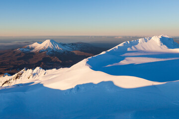 View from Mount Ruapehu, across summit plateau to Te Heu Heu and Tukino sub peaks and to Mount...