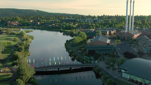 Aerial: Bridge crossing the Deschutes River in the Old Mill District, Bend, Oregon, USA