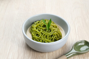 Petulo or Putu Mayang is a traditional Indonesian snack made from strands of rice flour rolled into a ball, colored with pandan or suji leaves, eaten with coconut milk and palm sugar.
