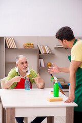 Two male contractors cleaning the house