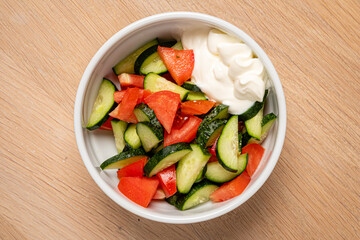 Tomato salad with cucumber, onion and parsley