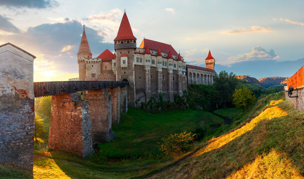 hunedoara, romania - OCT 13, 2019: corvin castle at sunrise. panoramic view of medieval fortification in morning light. one of the most beautiful landmarks in transylvania. popular travel destination