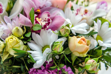 Festive bouquet of beige roses and chrysanthemums