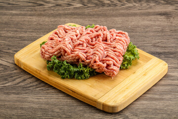 Raw pork minced meat over board
