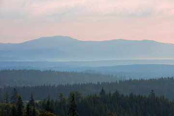 Fototapeta na wymiar foggy landscape between mountains in the morning
