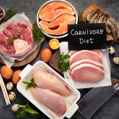 Carnivore diet on dark background. - obrazy, fototapety, plakaty