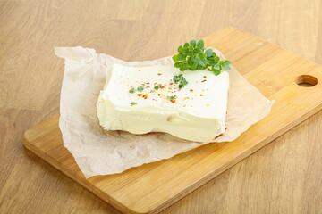 Greek Feta cheese over board