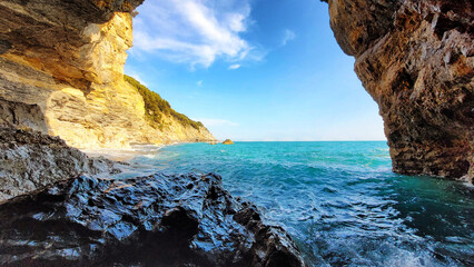Sea view from inside a cave of Punta Corvo Beach (Montemarcello, Ameglia, Italy). - 452659658