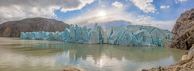 Panoramic view over Lago Grey and the edge of the Grey Glacier in Torres del Paine National Park in...