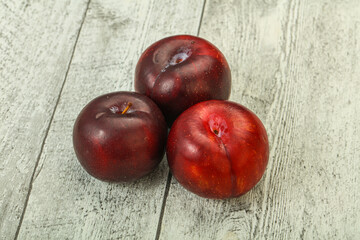 Ripe sweet plum fruit heap