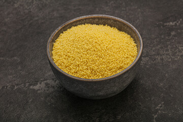 Raw cous cous heap in the bowl