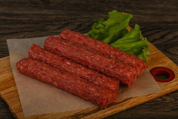Raw beef sausages with spices
