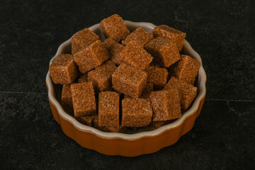 Cane sugar cubs in the bowl