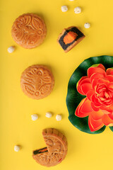 Top View Concept Mooncake, Traditional  Moon Cake, Dessert for Mid-Autumn Festival on Yellow Background, Close up, Lifestyle.