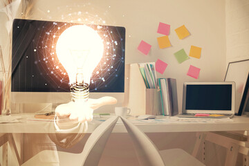 Double exposure of bulb and office interior background. Concept of idea.