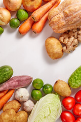 Prepare ingredients for healthy and nutritious meals. Purple sweet potato, ginger, bottle gourd... on white background. Top view. Clean and Fresh Food. Healthy vegetables. Space for text
