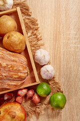 Prepare ingredients for healthy and nutritious meals. Potato, dry onion, red pumpkin, lemon on brighten wooden background. Top view. Clean and Fresh Food. Healthy vegetables. Space for text