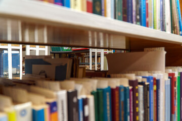 Books on a shelf in the library. Selective focus