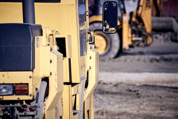 Heavy construction machines outdoors for public place reconstruction.