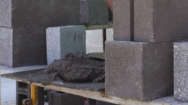 Large pile of Mud grout on a custom built scaffold.