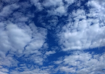 white clouds on a blue sky background