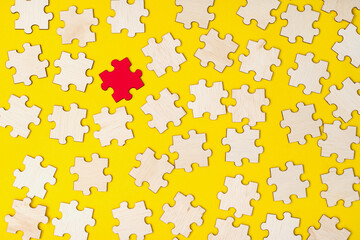 Human Resources concept. Jigsaw puzzles with one different color. Picking up the most outstanding person from the pool of candidates for the job. Symbolism. Selective focus points.