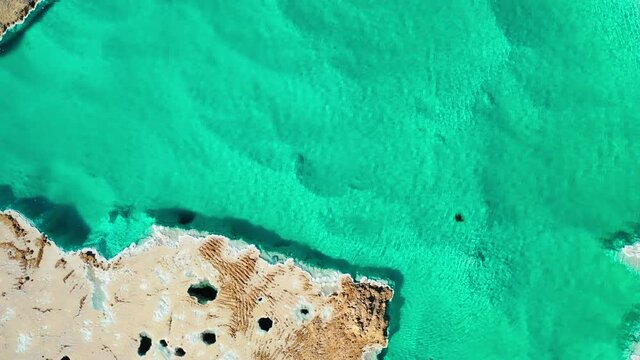 Aerial Top Upward Scenic View Of Salt Late Amidst Landscape, Drone Flying Over People On Vacation During Sunny Day - Siwa Oasis, Egypt
