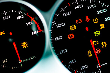 Fototapeta premium Car dashboard. Checking the system when starting the engine. A close-up of the speedometer and tachometer with additional instruments is illuminated. ..