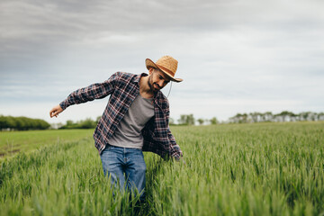 farmer walking through wheat field
