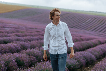 A man in a white shirt in a lavender field